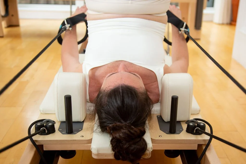Pilates Jack Knife exercise on the Reformer at Studio Di Rosa in Shankill, Dublin, demonstrating core control, strength and precision.