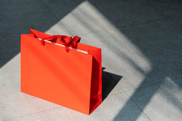 Red shopping bag on tiled floor