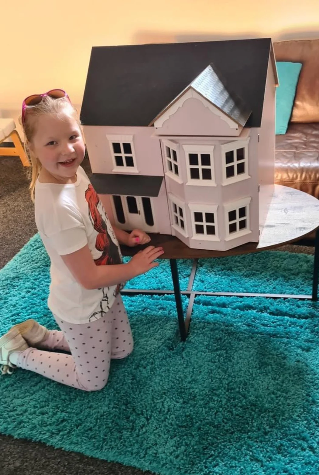 Girl with dolls house