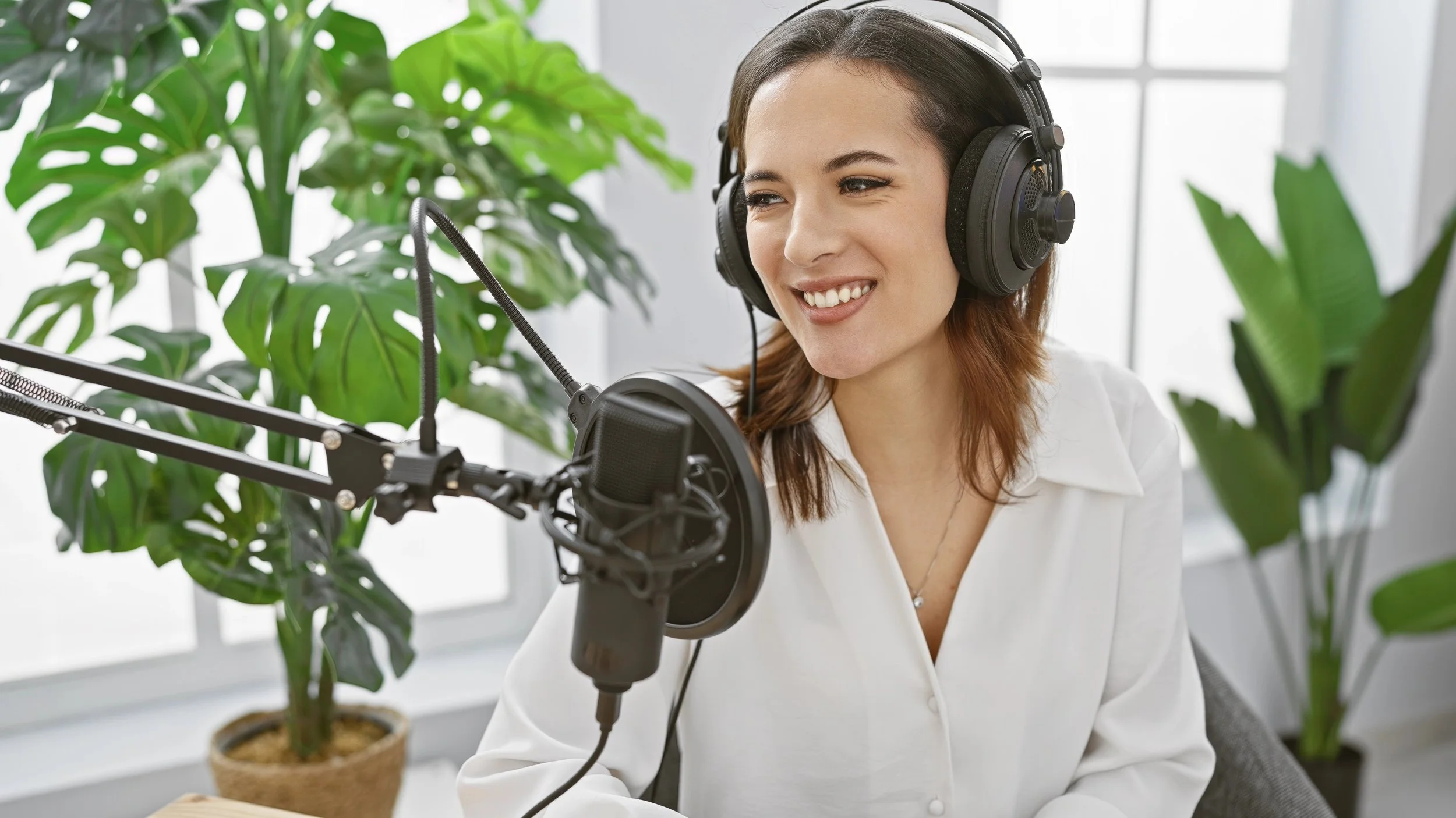 Woman with her own Podcast Smiling on air