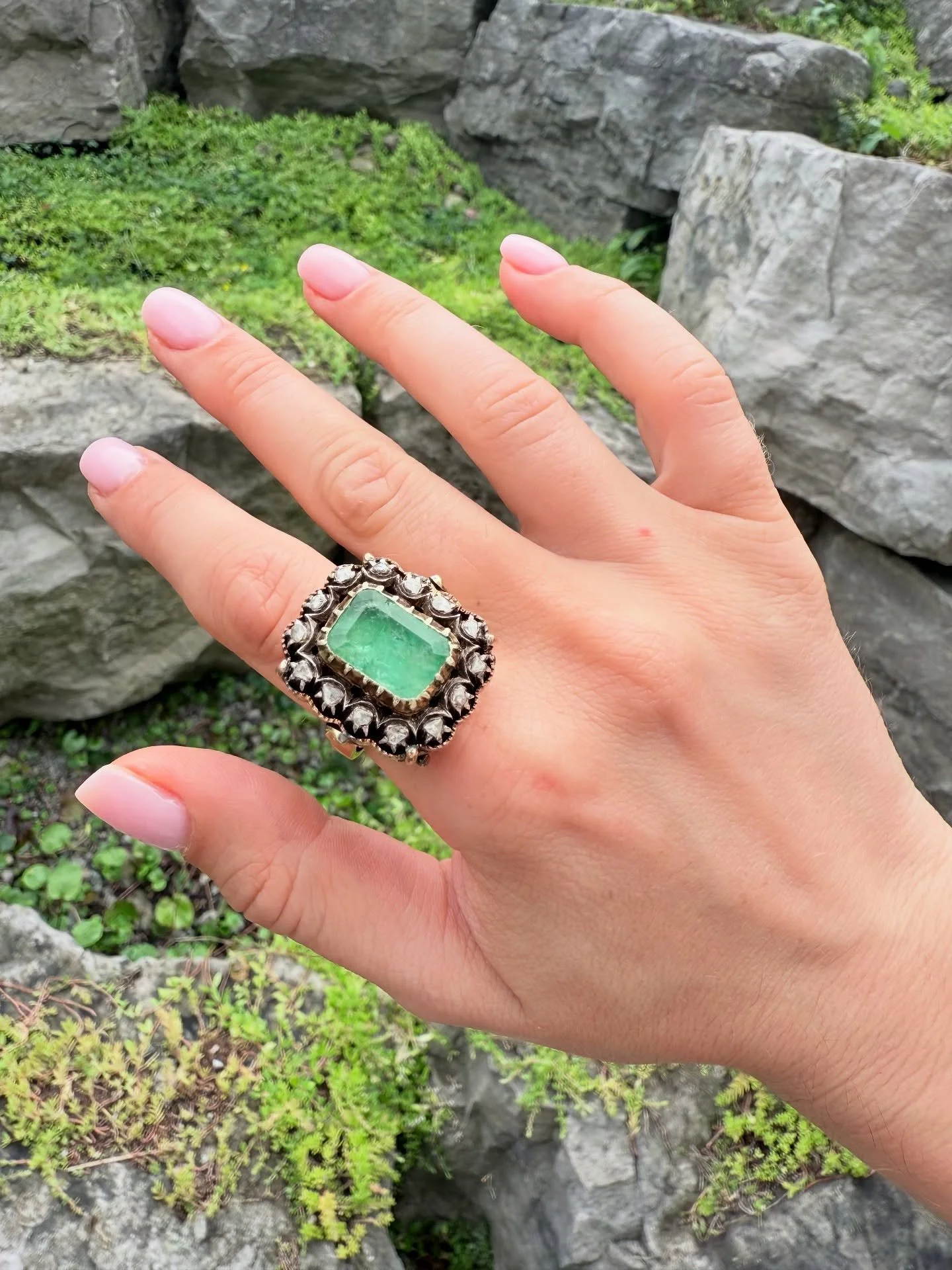 The coolest 14k vintage emerald ring surrounded by rose cut diamonds. Scroll to see how detailed the bottom is! Comes appraised. Size: 6.5 - 8 (it&rsquo;s adjustable). Price: $3200 CAD + Shipping