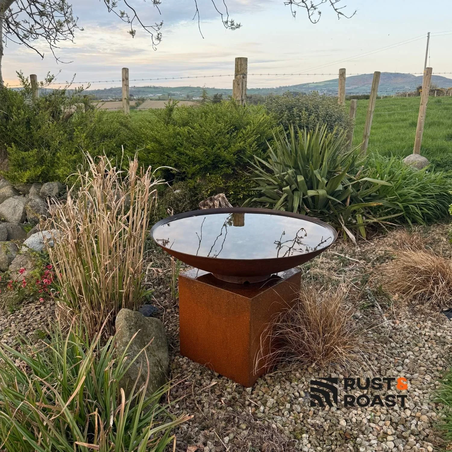 steel water feature corten steel pedestal garden setting