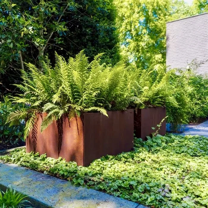 large square corten steel planter in modern UK garden