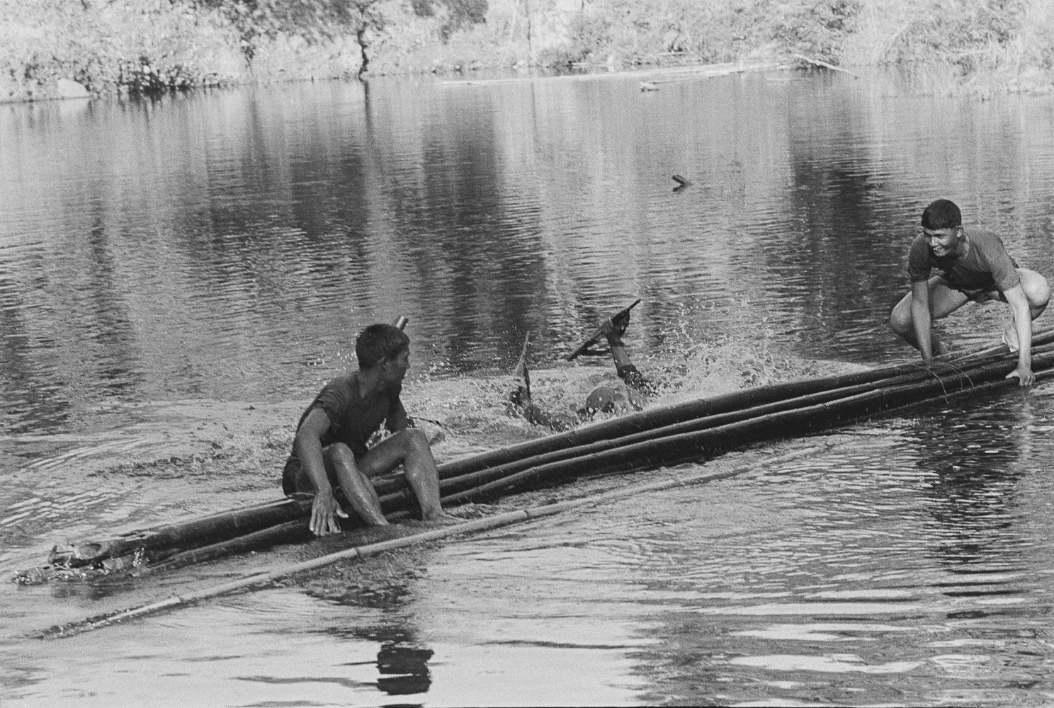 Crossing a river on a bamboo float