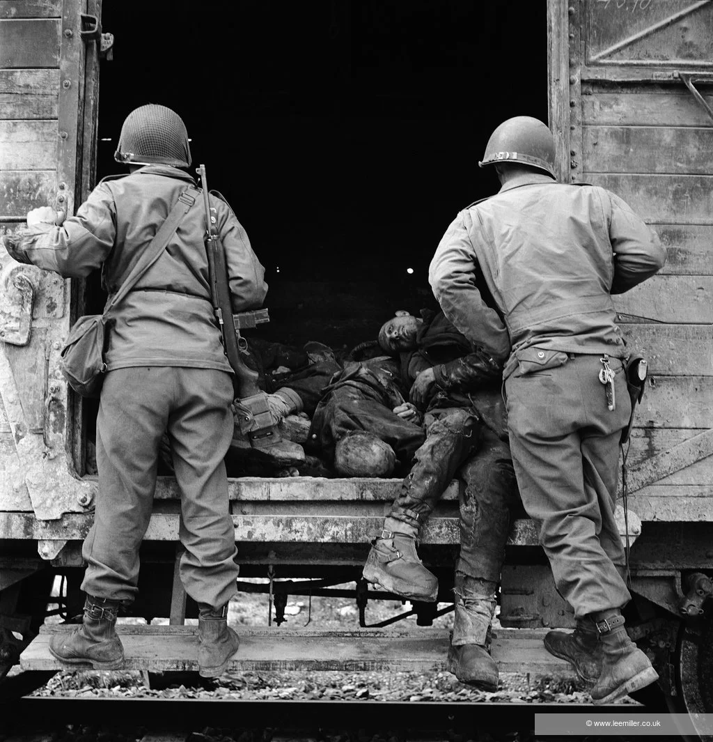 Lee Miller, US soldiers examine a rail truck load of dead prisoners, Dachau, Upper Barvaria, Germany, 1945 © Lee Miller Archives, England 2025. All rights reserved. leemiller.co.uk