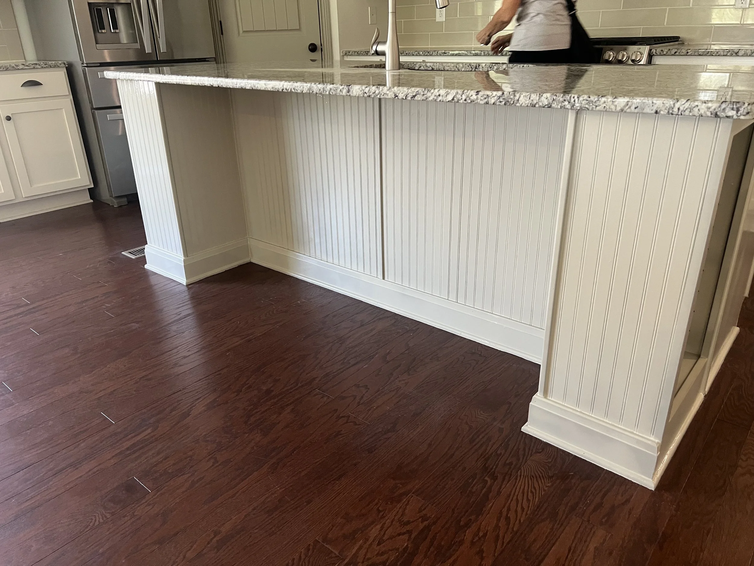 White beadboard kitchen island and cabinet refinishing in Nashville home