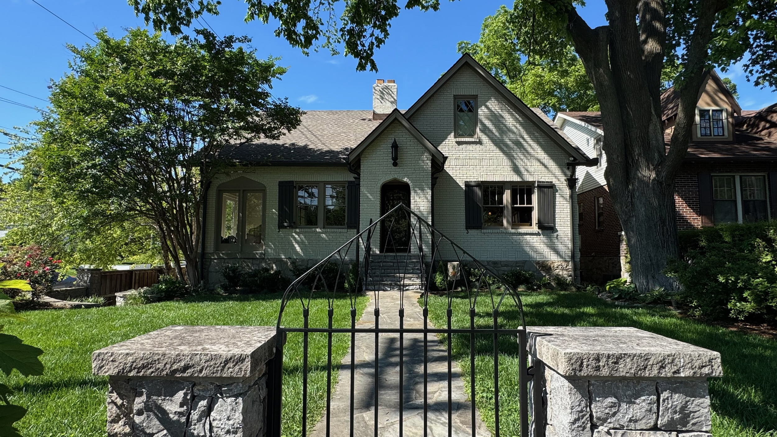 Freshly painted brick traditional home exterior in Green Hills, Nashville TN by The House Painters
