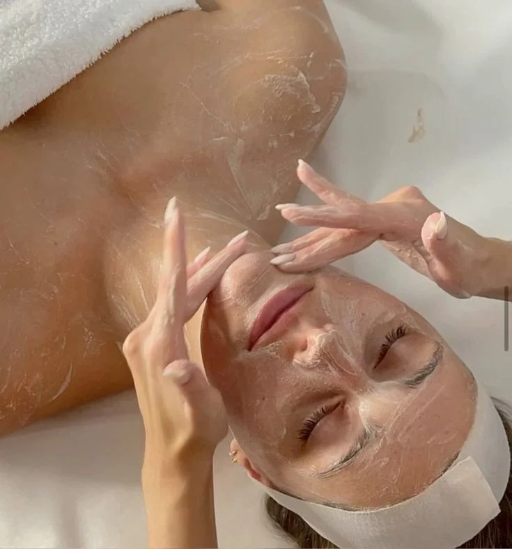 Esthetician performing signature facial massage at Beauty By Biba