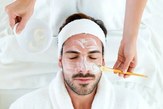 Man receiving professional facial treatment at Beauty By Biba skin spa
