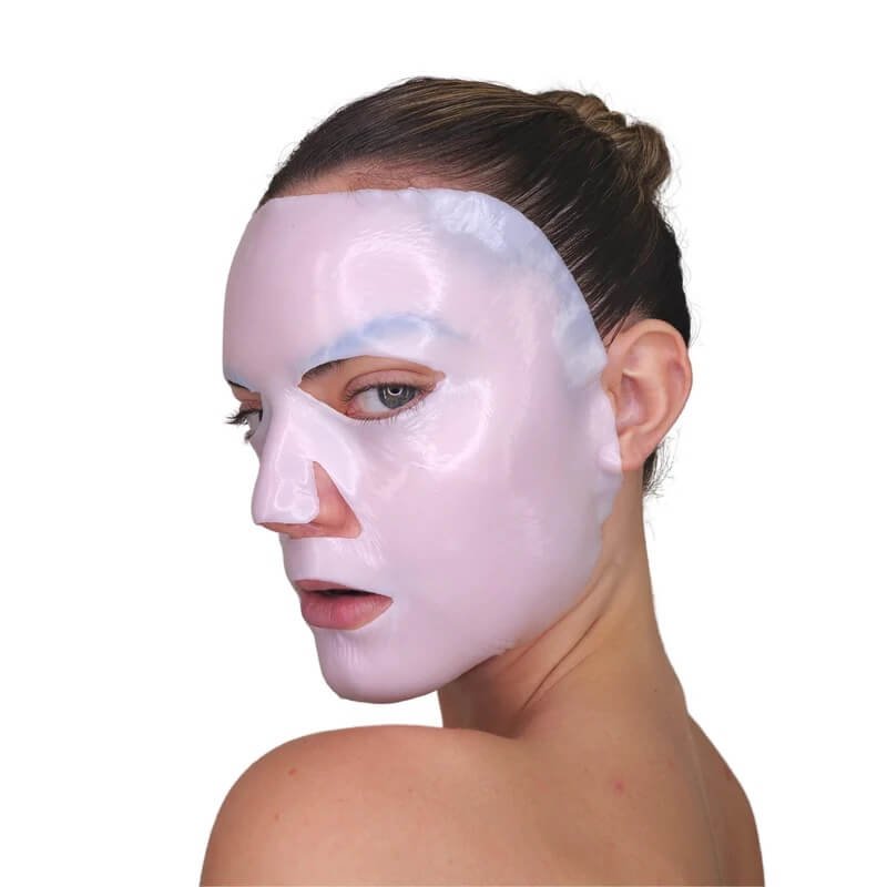Model wearing Velež Intense Hydration Mask, a cooling gel sheet mask that soothes redness and hydrates post-treatment or sensitized skin.