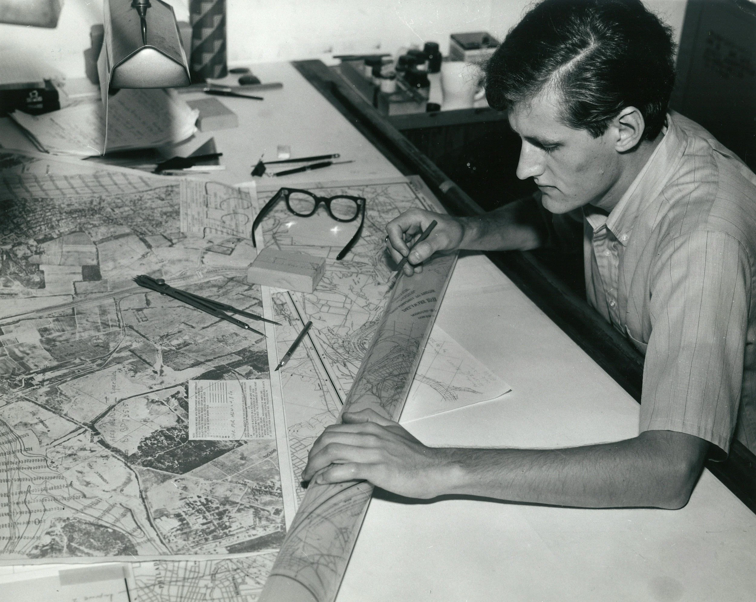 A researcher looking at a map of a territory.