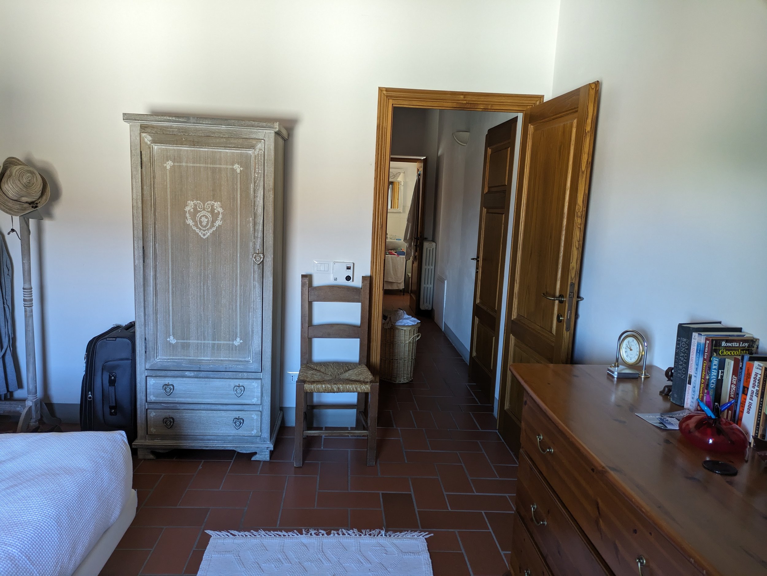To the right at the top of the stairs is the larger bedroom