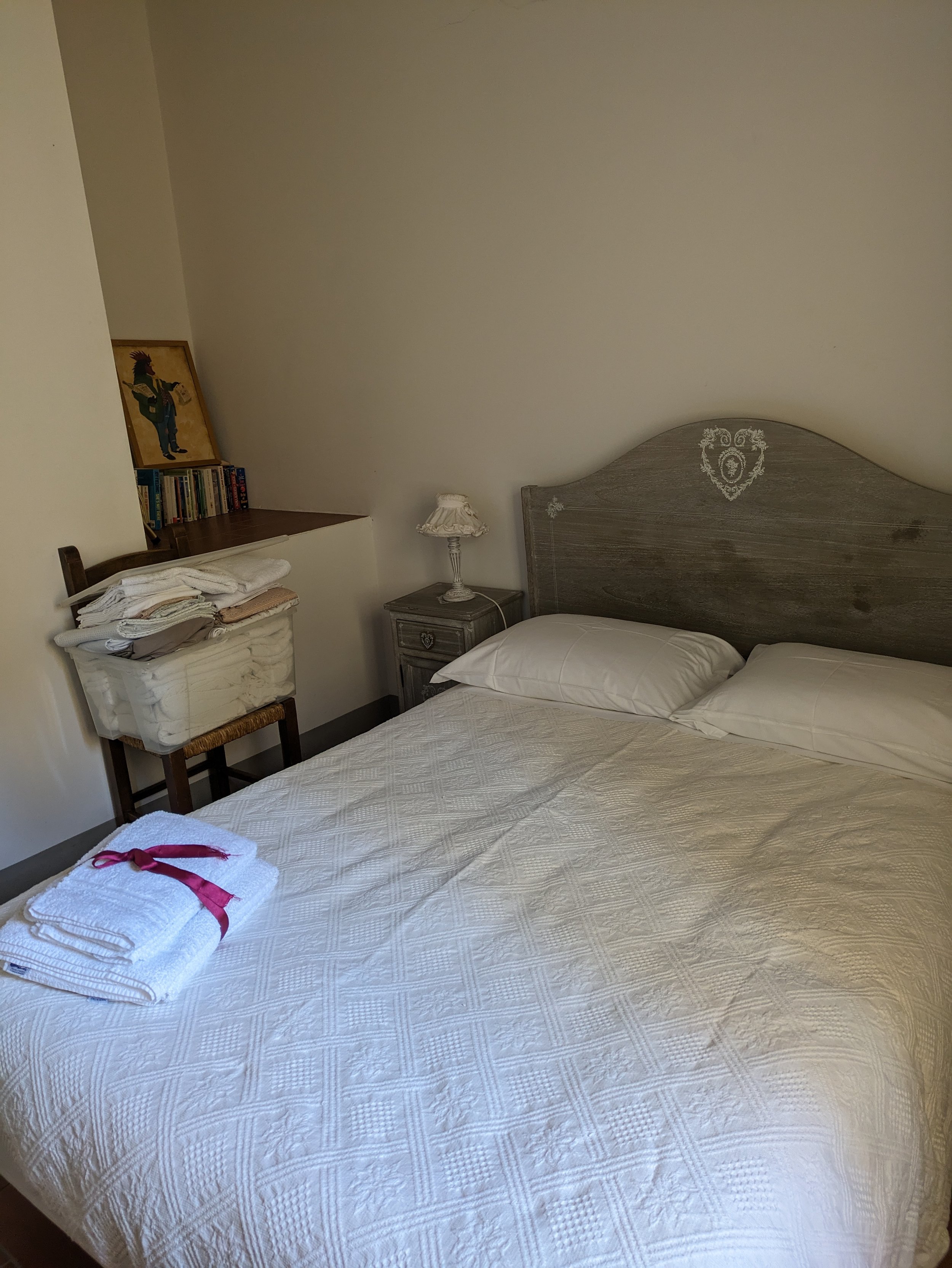 To the left at the top of the stairs is the second bedroom
