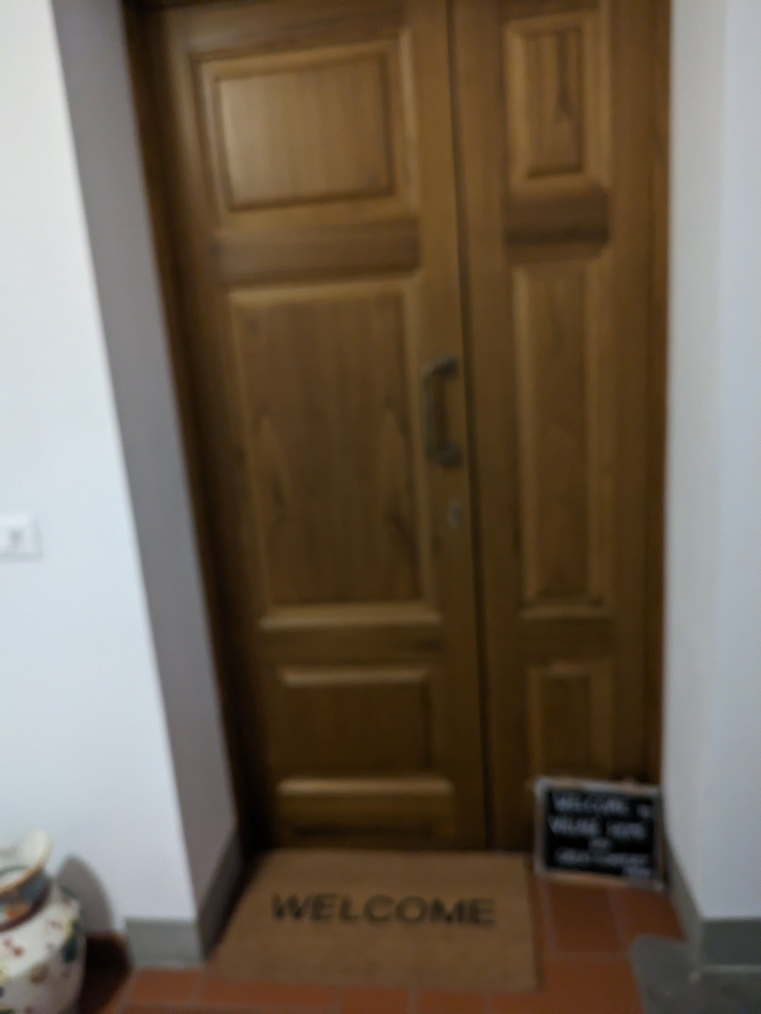 Take two small flights of stairs to arrive at my door