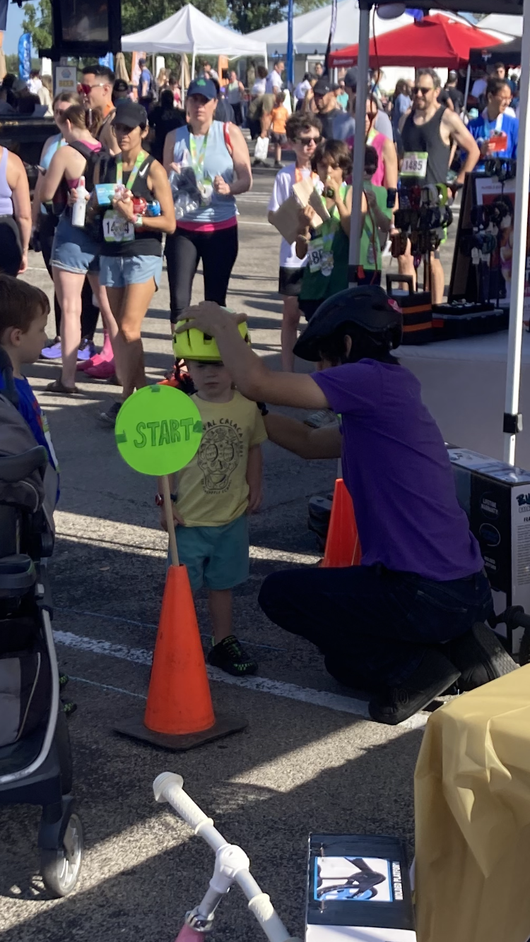 Kids race start line at a community event