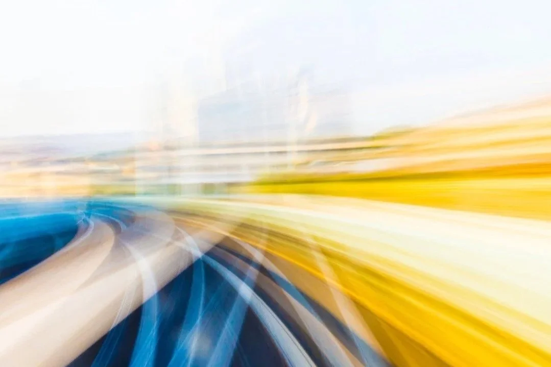 Abstract motion blur image representing speed and forward momentum, used to illustrate a quick recap of a client’s downsizing journey.