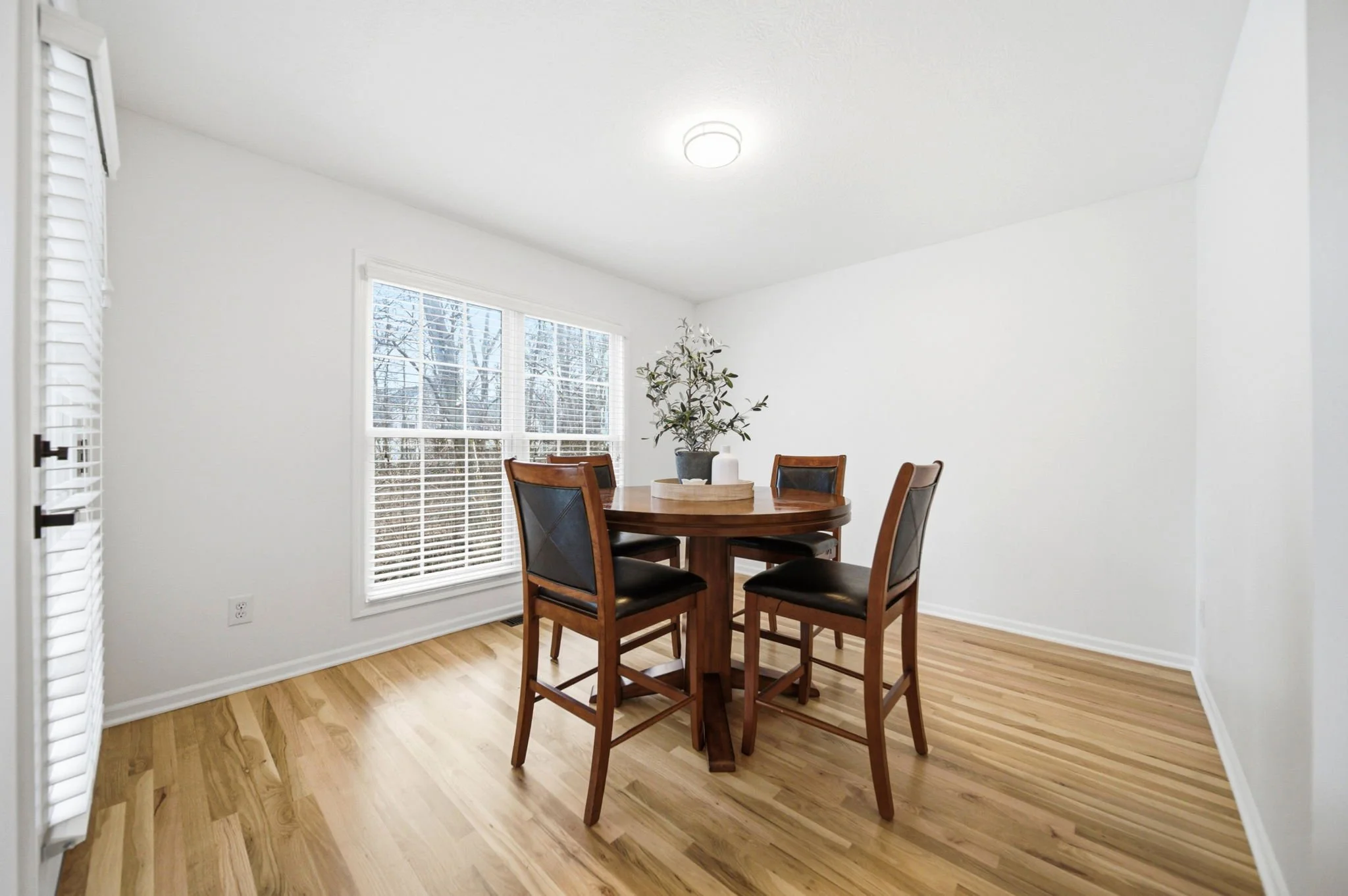 Natural light streams through the window of this eating area in a property for sale in Gahanna, Ohio.