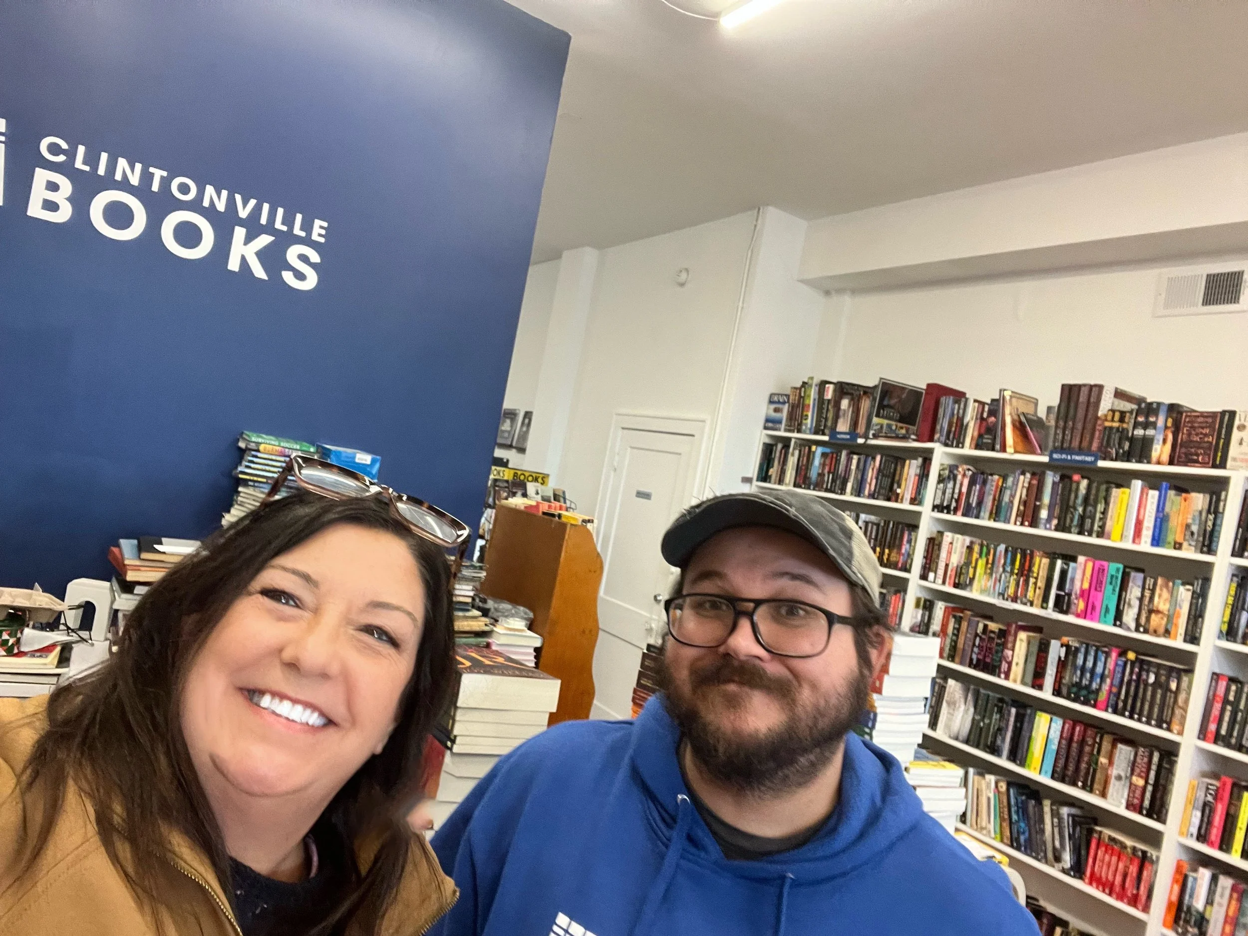 Liz Koehler poses for a selfie with the friendly staff at Clintonville Books, an independent bookstore in the Clintonville neighborhood of Columbus, Ohio.