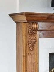 An intricately carved walnut mantel in a 1929 home in Columbus Ohio