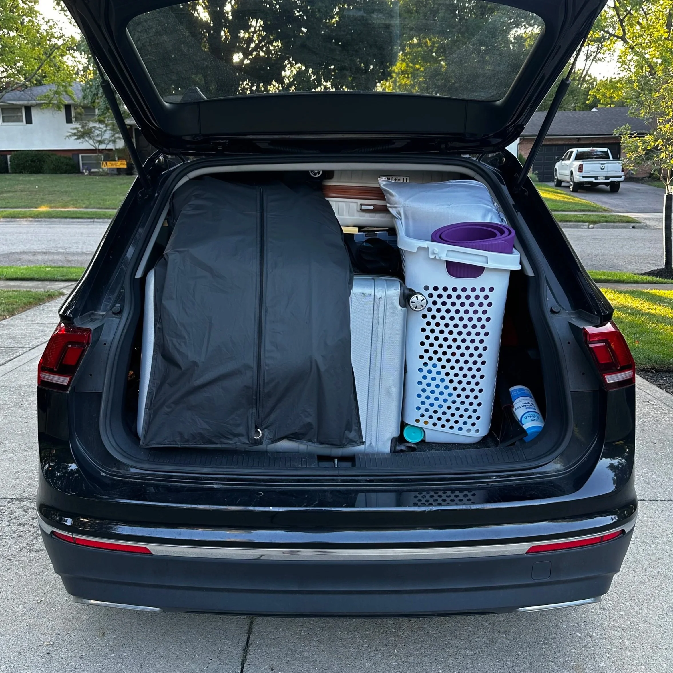 An SUV packed to the roof with college supplies before moving a student into an off-campus home, illustrating the many costs and logistics families navigate each school year.