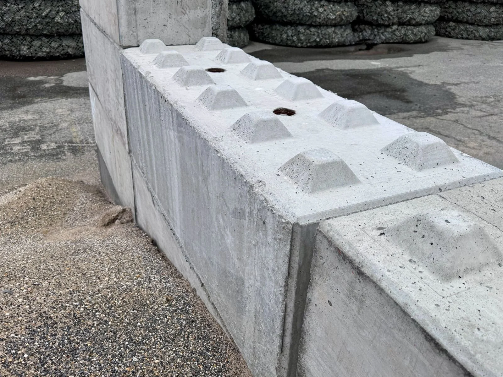 2-foot by 2-foot by 6-foot precast concrete Benton Blocks manufactured by Ionic Order for construction and infrastructure applications.