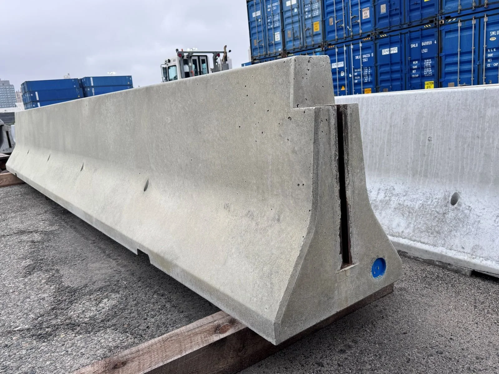 Precast concrete production at Ionic Order supporting expanding manufacturing capacity for infrastructure projects. 20' NYCDOT barrier.
