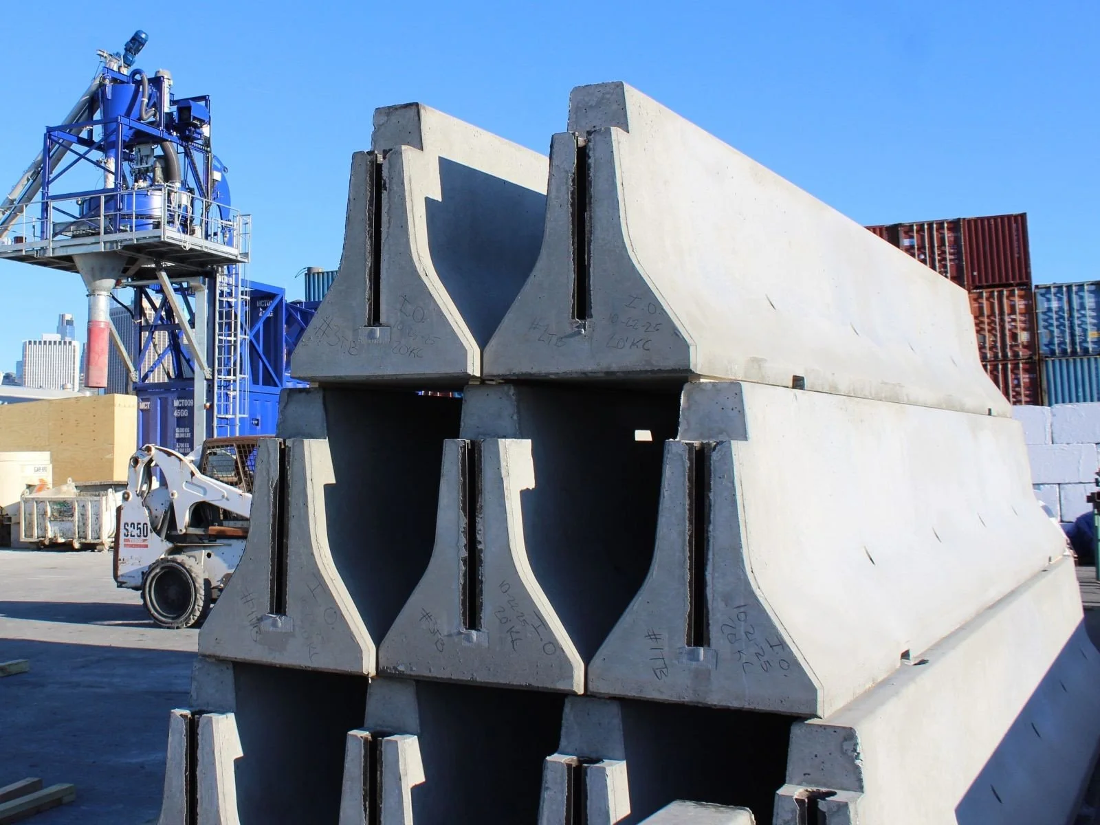 Precast concrete barriers stocked at Ionic Order's manufacturing facility for transportation projects.