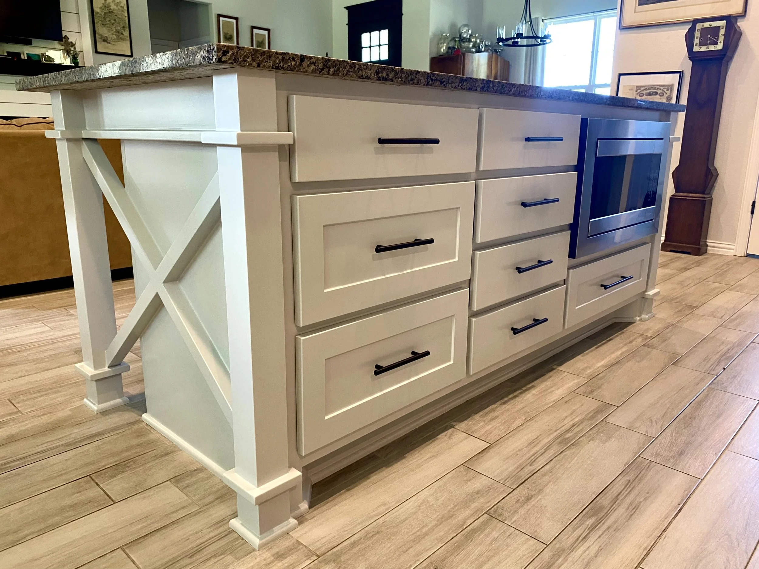 Kitchen island cabinets painted in a light finish by A3 Painting Services