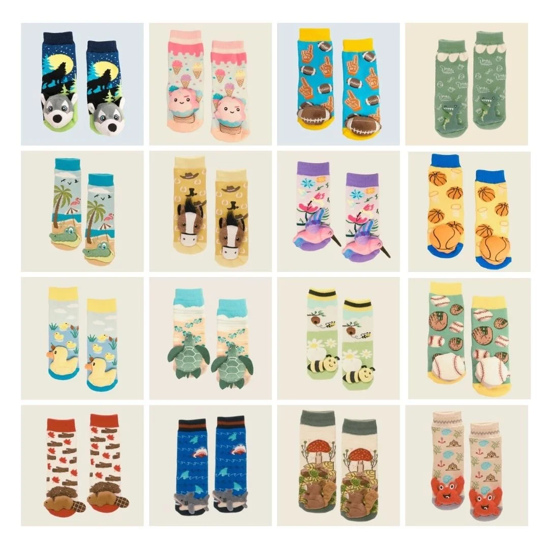 A collection of colorful novelty socks with various patterns and themes, including animals, sports, tropical scenes, and fantasy designs.