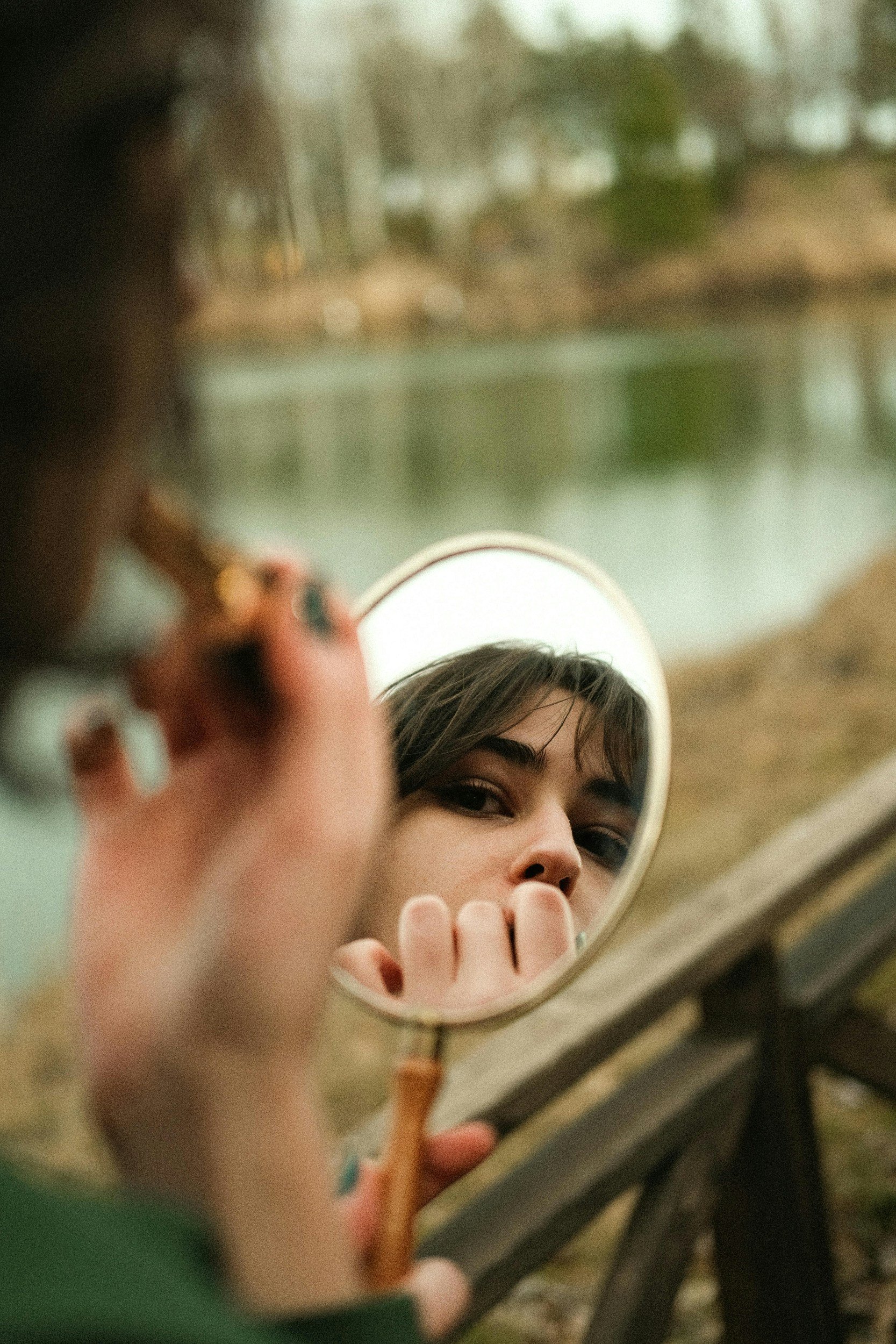 face looking into mirror