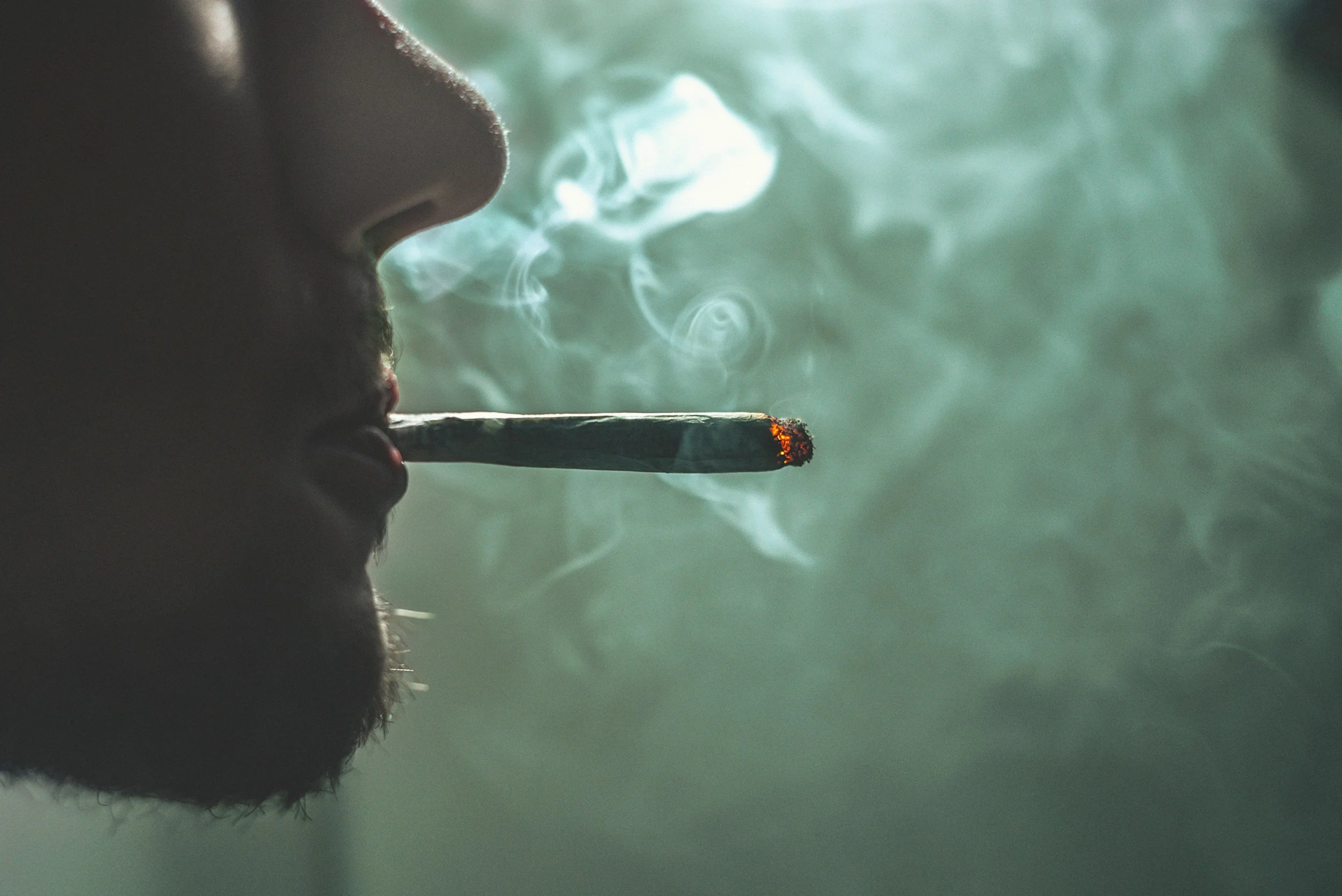 man smoking a joint