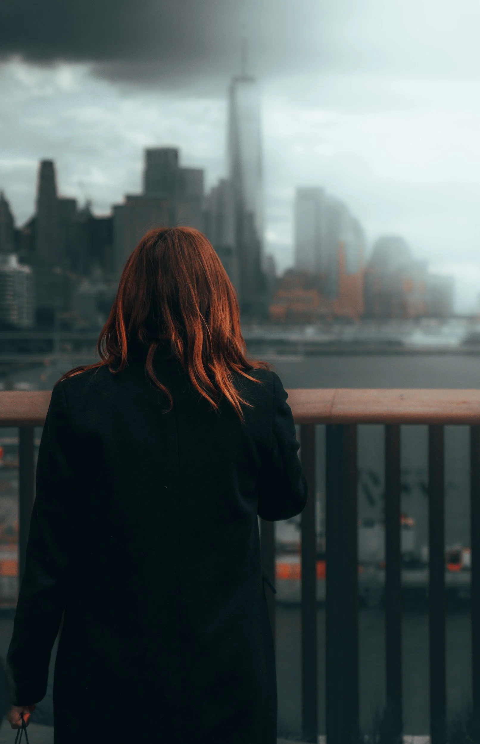 woman looks over nyc skyline