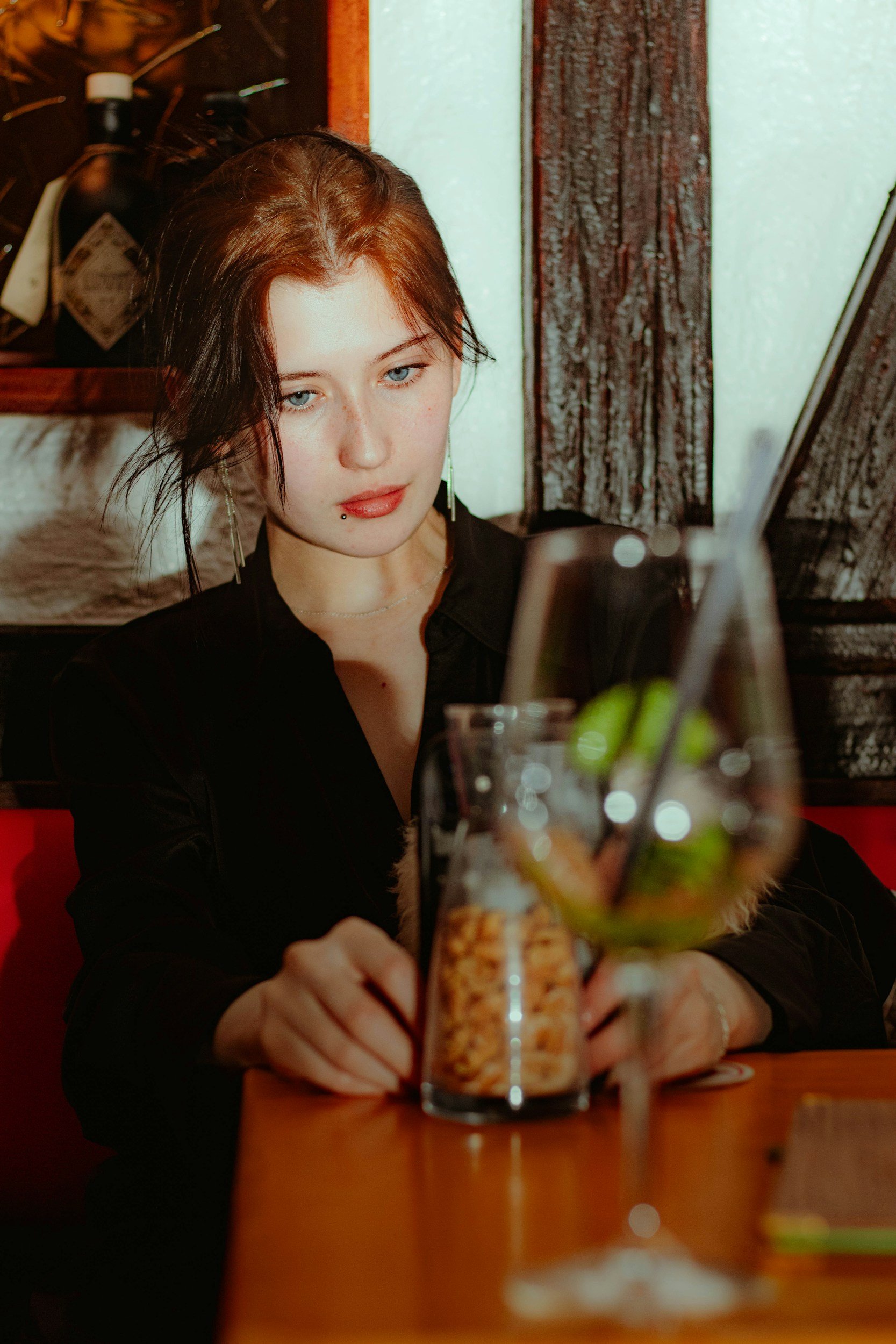 Young adult reflecting over food and a drink