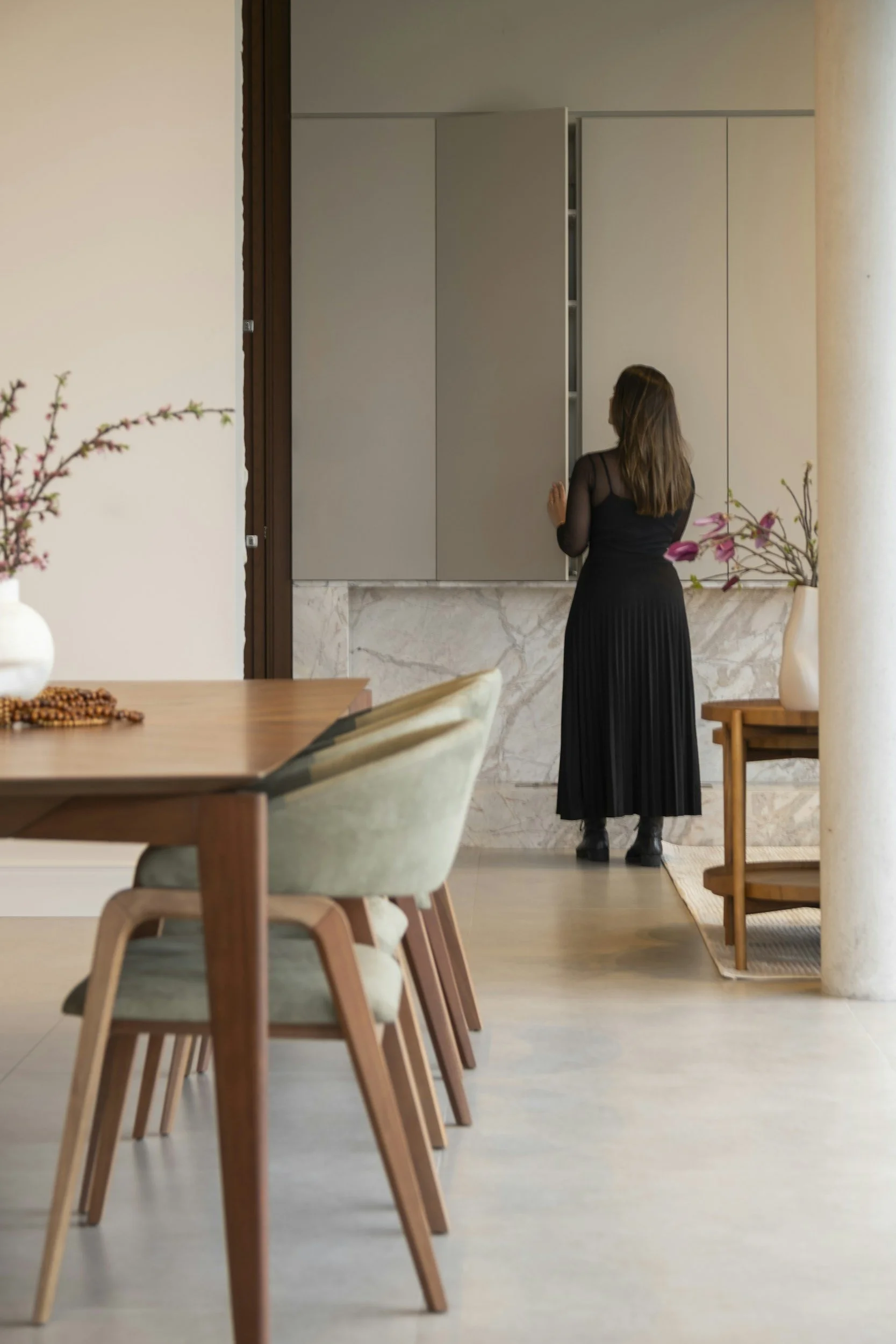 woman looking in kitchen cupboards