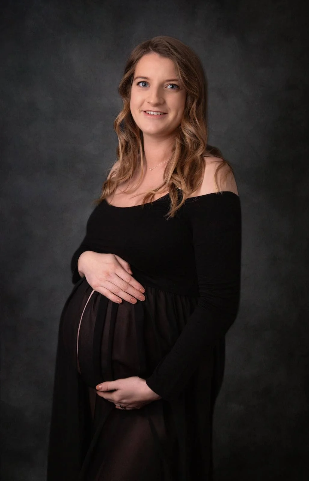 An expectant mum who joined pregnancy yoga in Malton, smiles at the camera