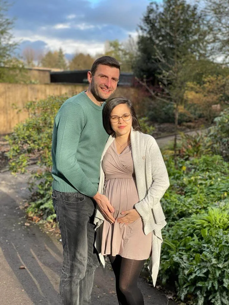 Expectant couple smiling and hugging after completing an antenatal workshop in Malton