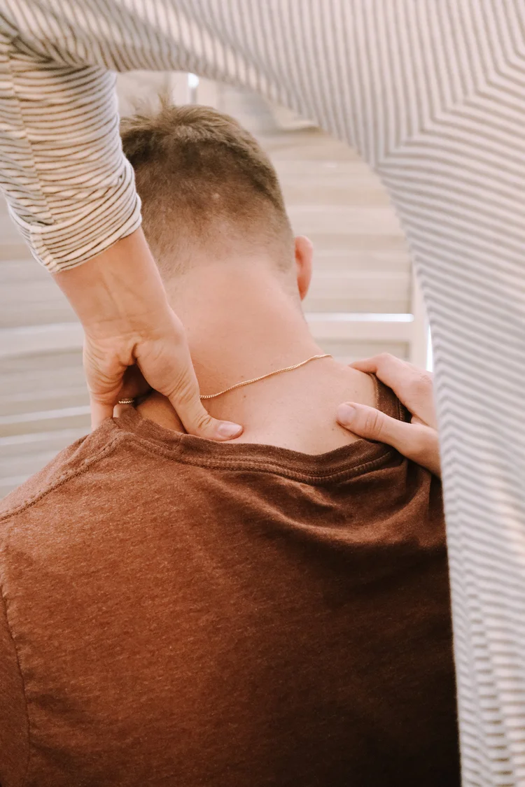 Hands-on care for an adult at W Bar Chiropractic