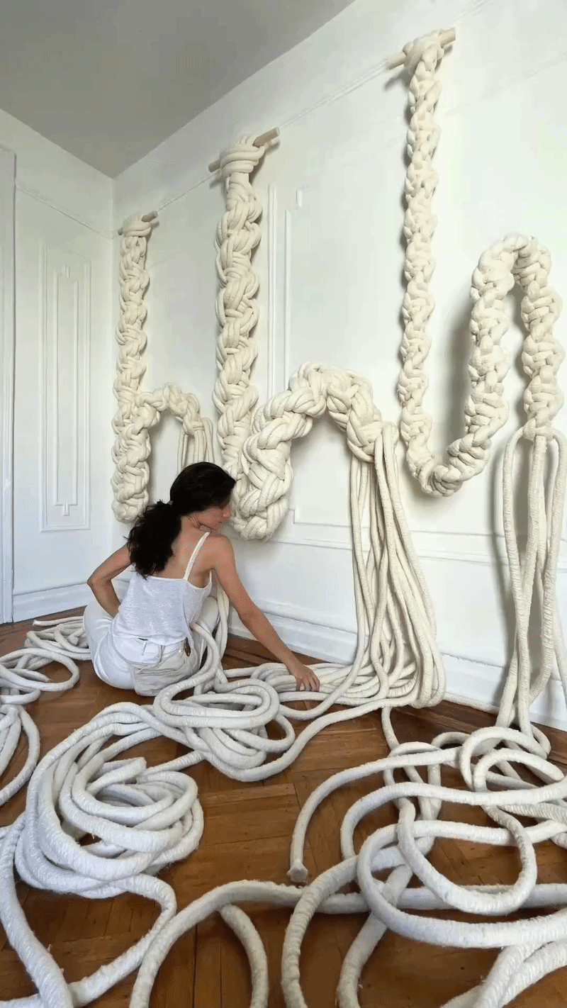 Maeve Pacheco making thick white rope sculptures in her Brooklyn studio