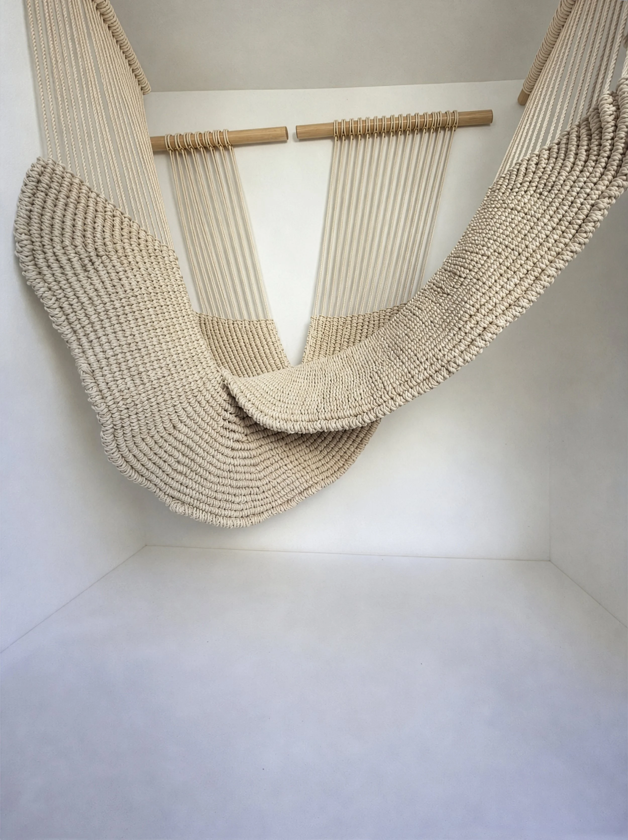 Contemporary macramé sculpture installation made from thick cotton rope