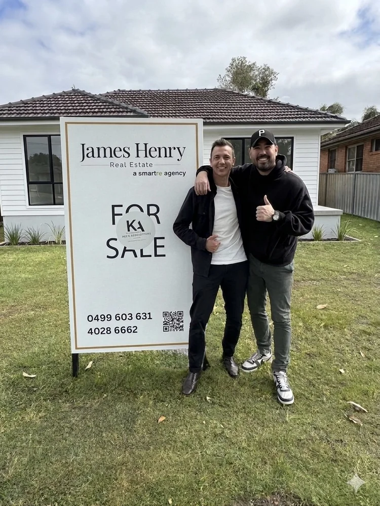 Mitch Keen with a client in front of their new home