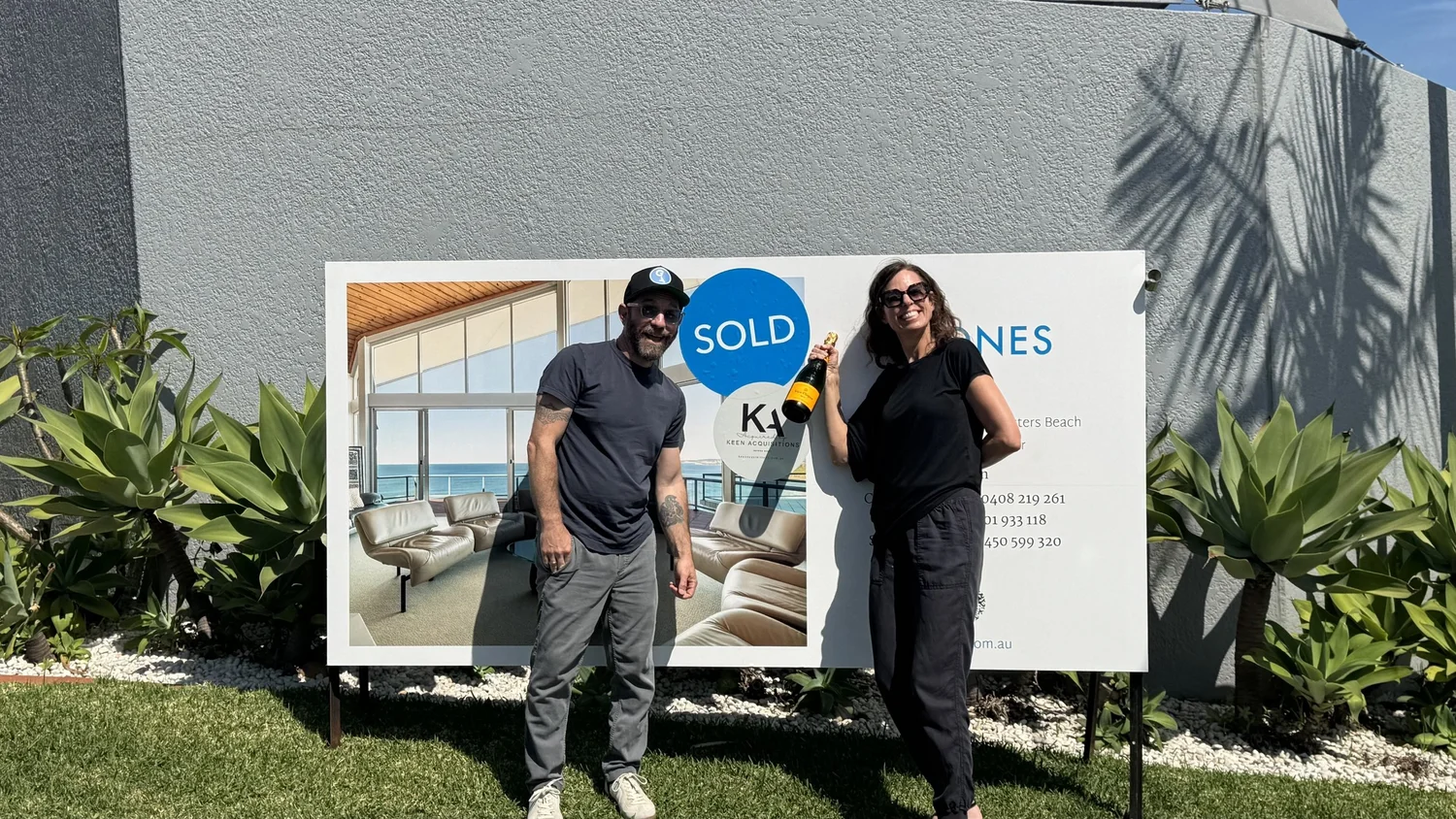 Mitch Keen with buyers outside their new home
