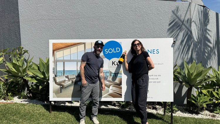 Mitch Keen with buyers outside their new home