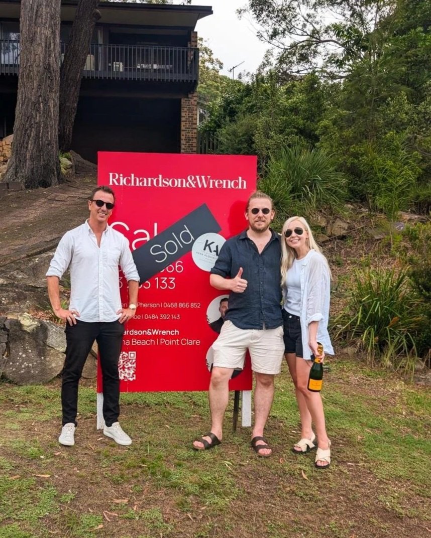 Mitch Keen with clients after settlement