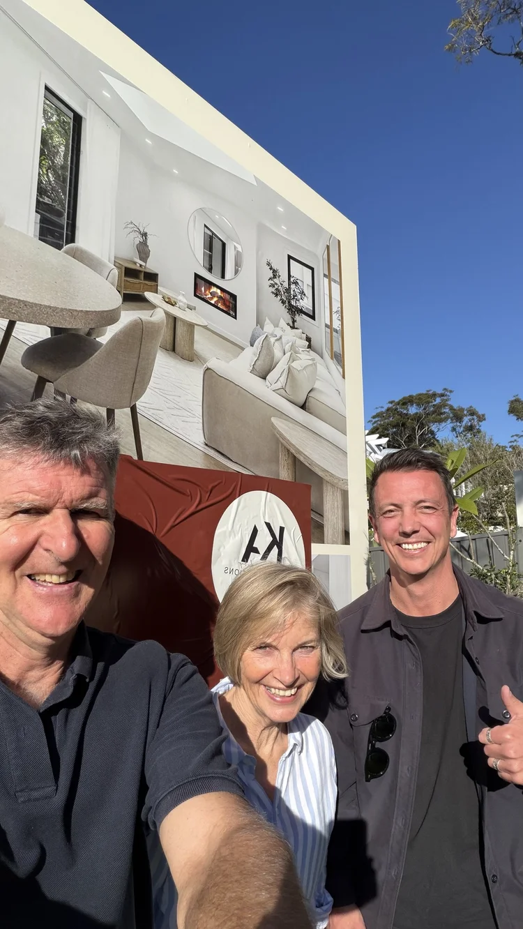 Mitch Keen with happy buyers outside their new home