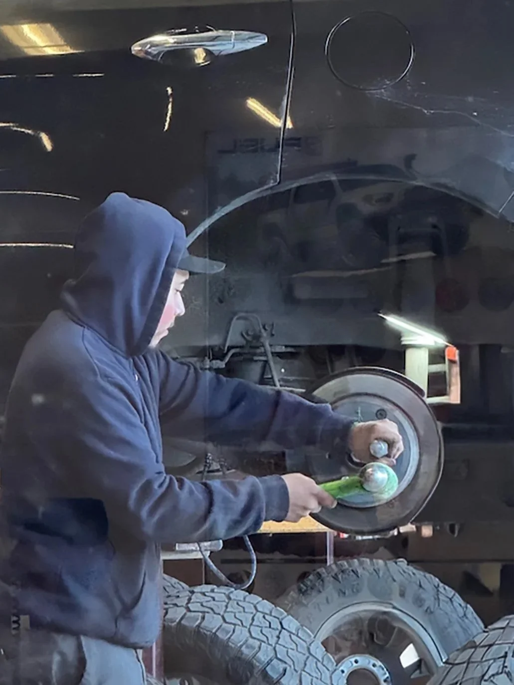 A moment in the middle of a brake job. Heavy parts, real effort, and a lot of patience, with careful attention to every detail. Brake work takes time, strength, and care, because your safety depends on it.