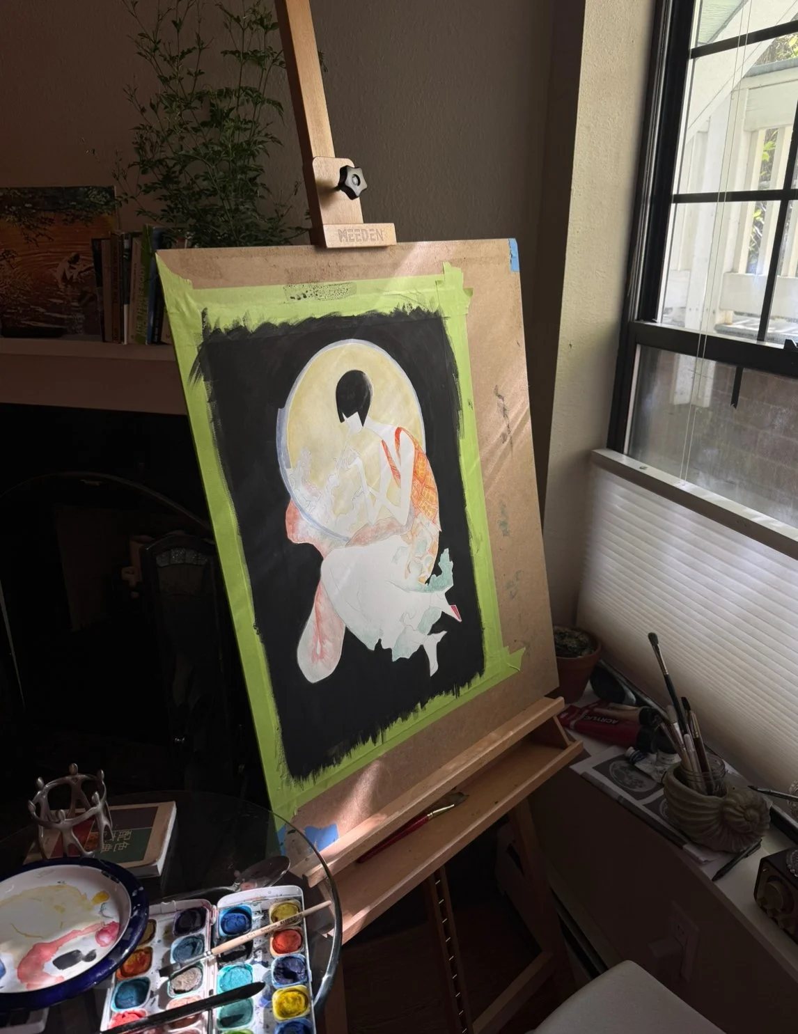 An art easel holding a partially completed painting of a stylized woman with dark hair, dressed in patterned clothing, against a black background with a yellow moon.