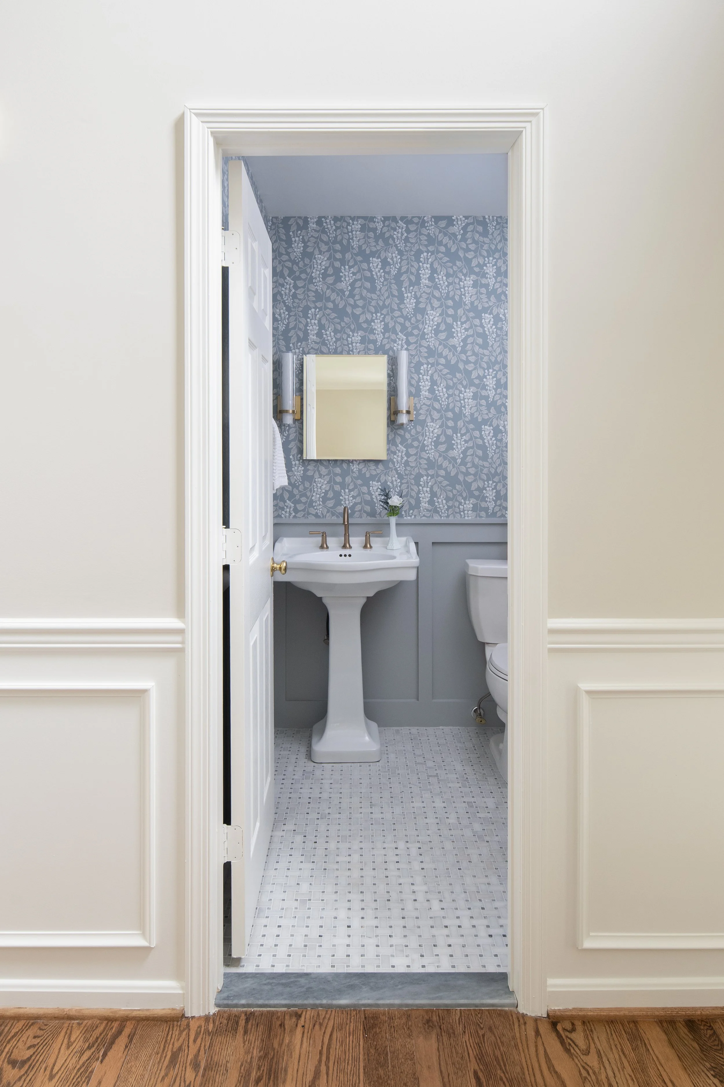 Blue wallpaper powder room pedestal sink