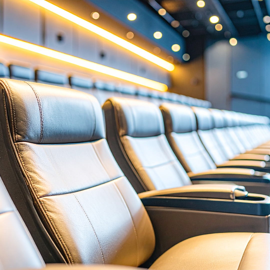 Home theater with ambient lighting strips and ceiling lights