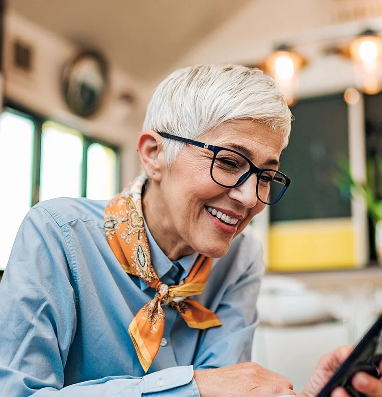 A happy senior woman with eyeglasses