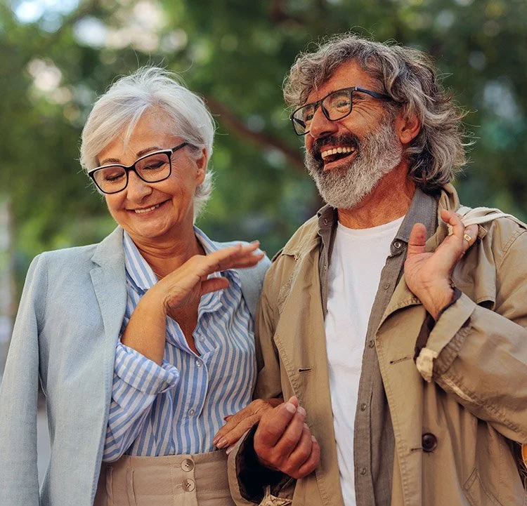 A happy senior couple with eyeglasses seeing without blocked vision